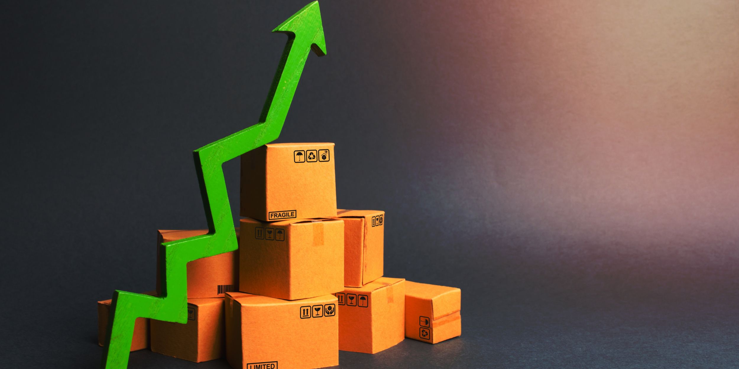 International Consumer Goods Manufacturing: boxes and an arrow pointing to the sky representing a financial incline.